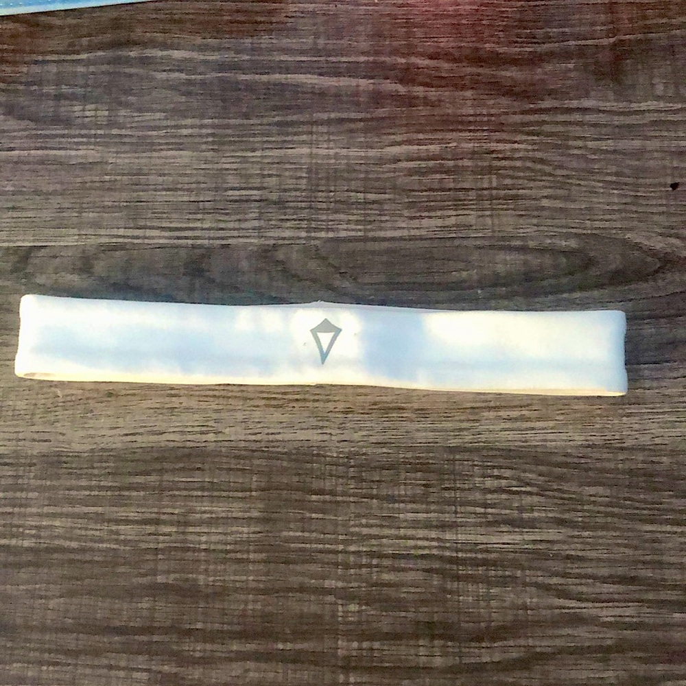 white ivivva (lululemon brand) headband.